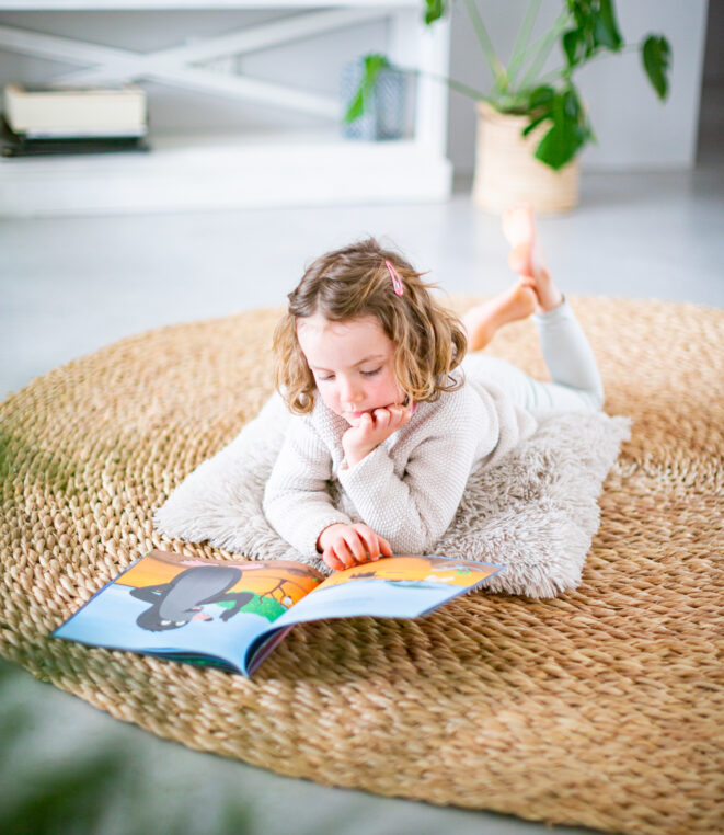Cole the mole - Girl reading Cole the mole - heart-warming children's story set in the African wilderness